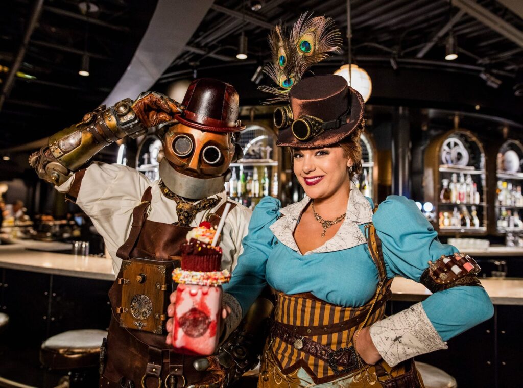 Os donos do restaurante The Toothsome Chocolate Emporium caracterizados Os donos do restaurante The Toothsome Chocolate Emporium caracterizados